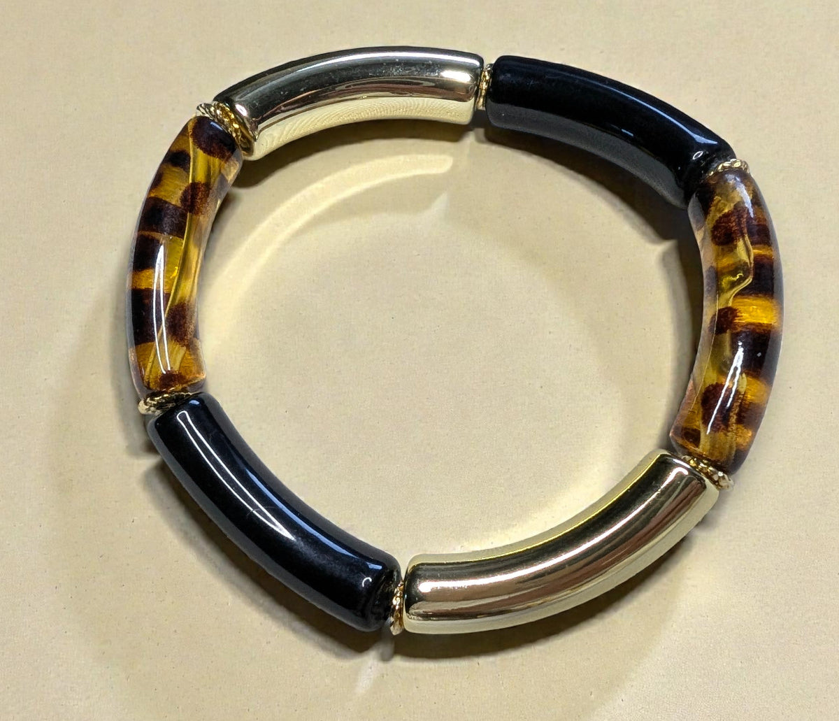 Bracelet élastique en perles de résine – doré, noir et léopard transparent