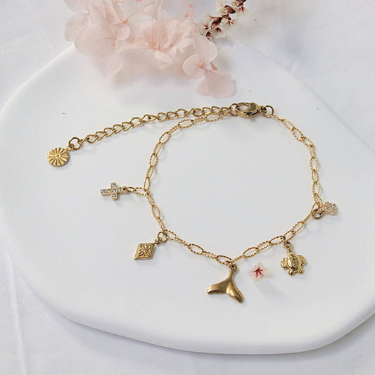 Bracelet en acier inoxydable doré Orély, mailles fines et charms symboliques lumineux