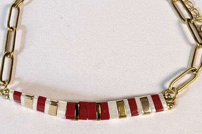 Détail de la chaîne trombone dorée du bracelet Rosso, élégante et moderne.