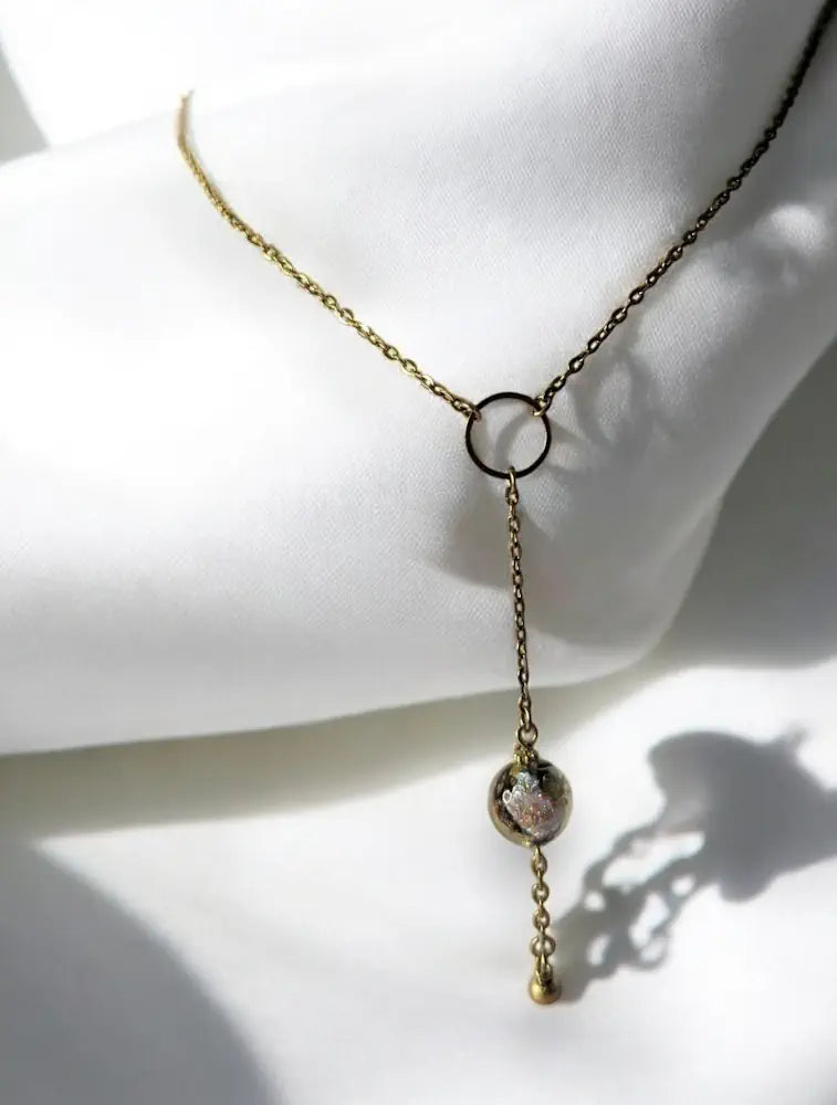 Collier Vénézia en acier doré avec anneau central et perle de Murano 