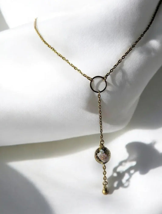 Collier Vénézia en acier doré avec anneau central et perle de Murano 